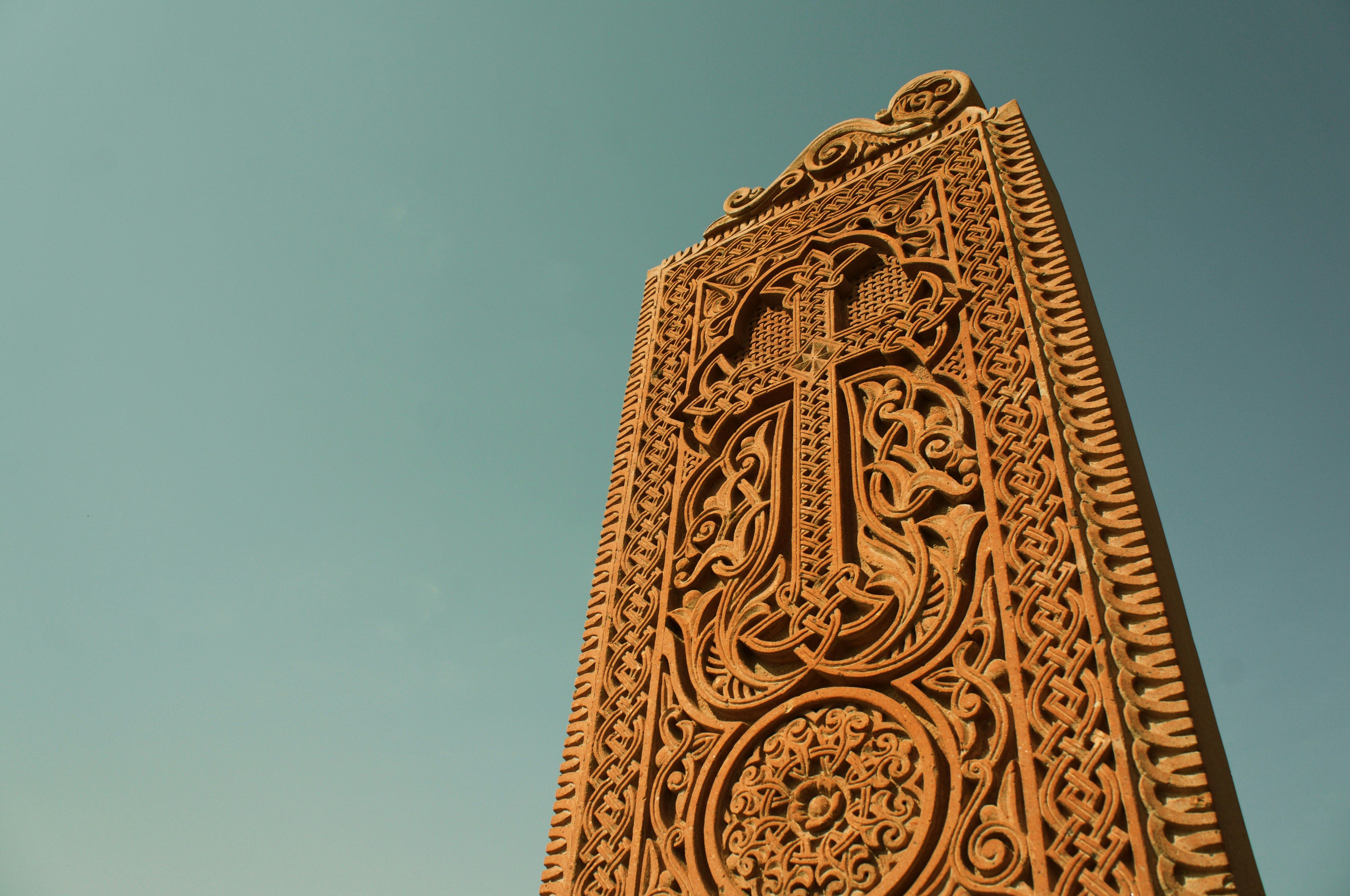 brown concrete cross statue